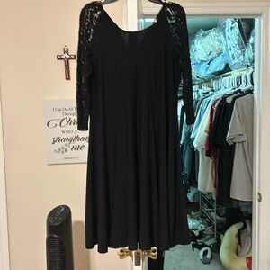 Black dress with embroidered 3/4 sleeves.